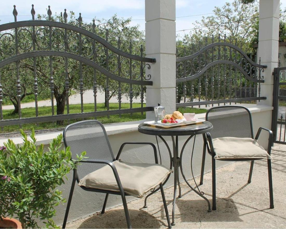 Breakfast served on the wrought-iron balcony table