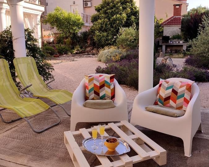 The terrace with sun chairs and a pallet coffee table