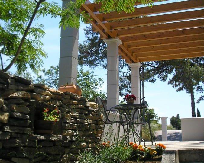 A shaded pergola corner in the garden