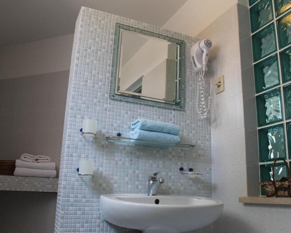 The mosaic-tiled bathroom