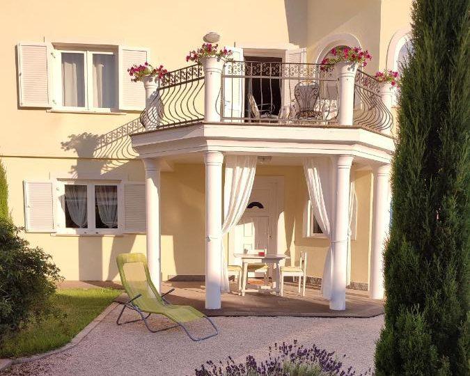 The porch with sun chairs under the balcony