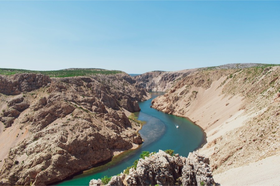 The Zrmanja river winding through a limestone canyon